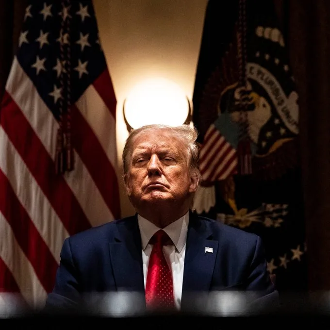Trump with the lamp behind him forming horns